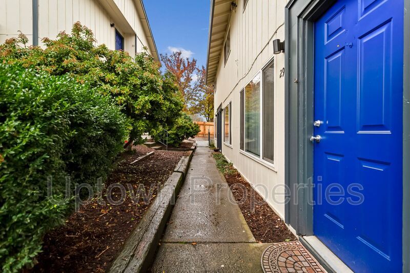 **June FREE RENT + $500 Security deposit + Application Fees Waived** Renovated 2 bed 1 bath Townhome w/ Private Yard - Wood Floors + Laundry Onsite - Walk to public transit!! property image